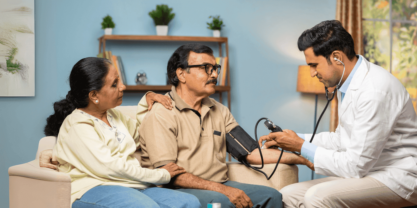 Doctor consulting a couple at home